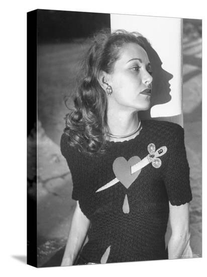 Model Wearing Sweater with Heart Pierced by Jeweled Dagger Model Wearing Sweater with Heart Pierced by Jeweled Dagger